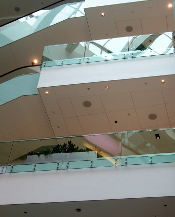 Upward view of 3 levels at a Shopping Mall Chicago, IL, Optik guardrail with clear glass