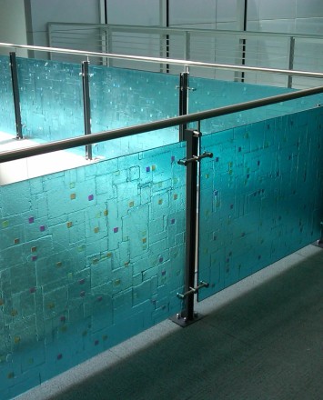 Angle view of Ferric guardrail with glass infill installation in the RCC Lobby, New York Transit, NY.