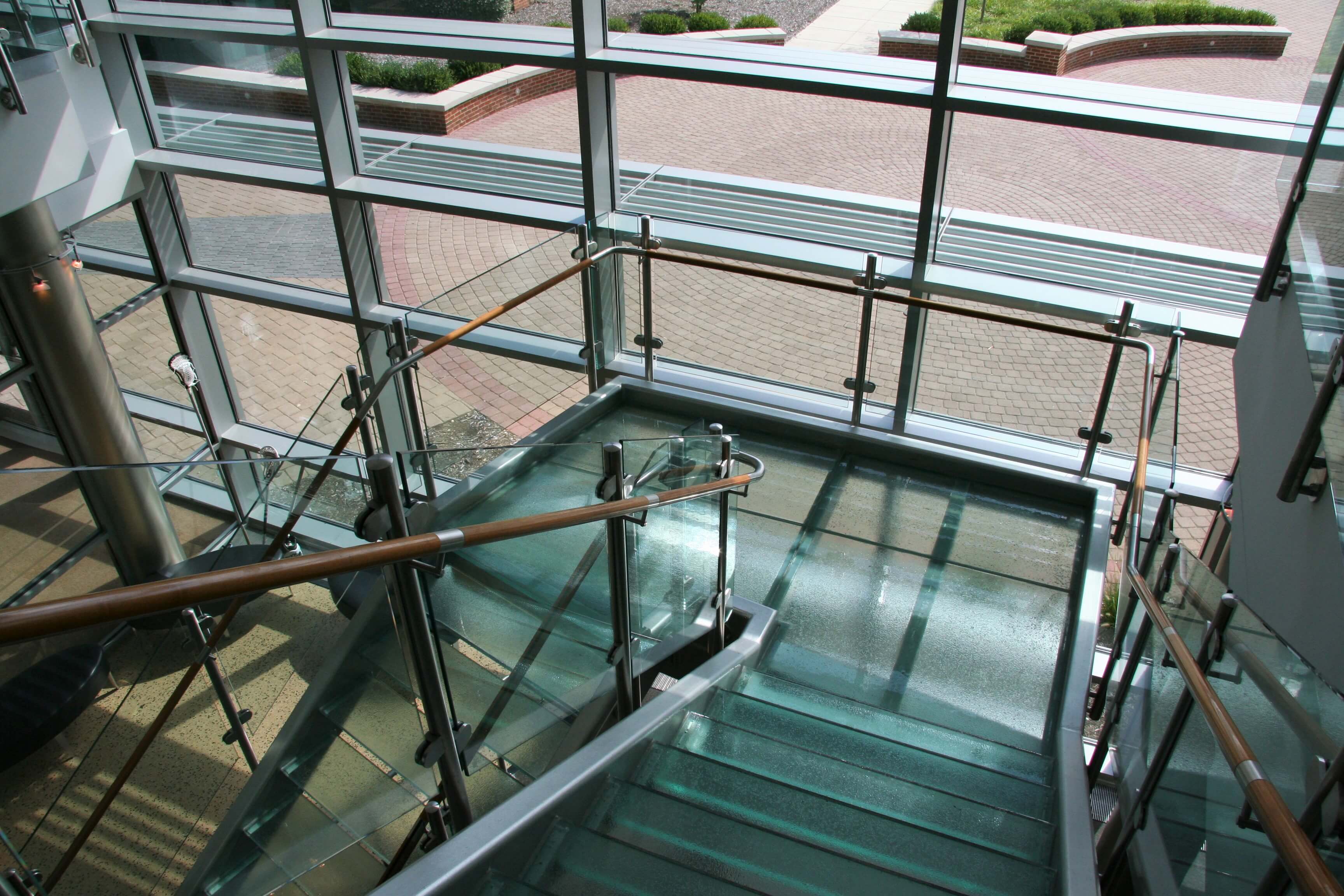 Sunlit view of Circum guardrail installation with glass infill at Blackhawk College, MD.