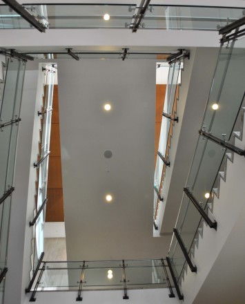 Ferric guardrail with glass infill installation at LA Live Convention Center, CA.