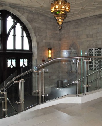 Stairwell view of Konic guardrail installation with glass infill at Mount Saint Mary's, NY.