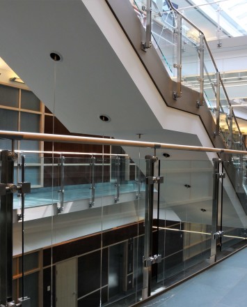 Inox wooden rail with glass infill installation in Du Page Medical Center, OH