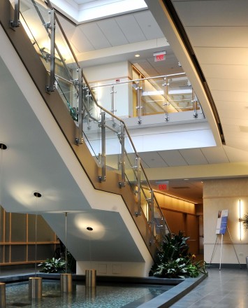 Inox wooden rail with glass infill installation in Du Page Medical Center, OH