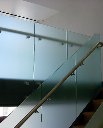 Upward stairwell view of Office building, CA, Optik guardrail with opaque etched glass