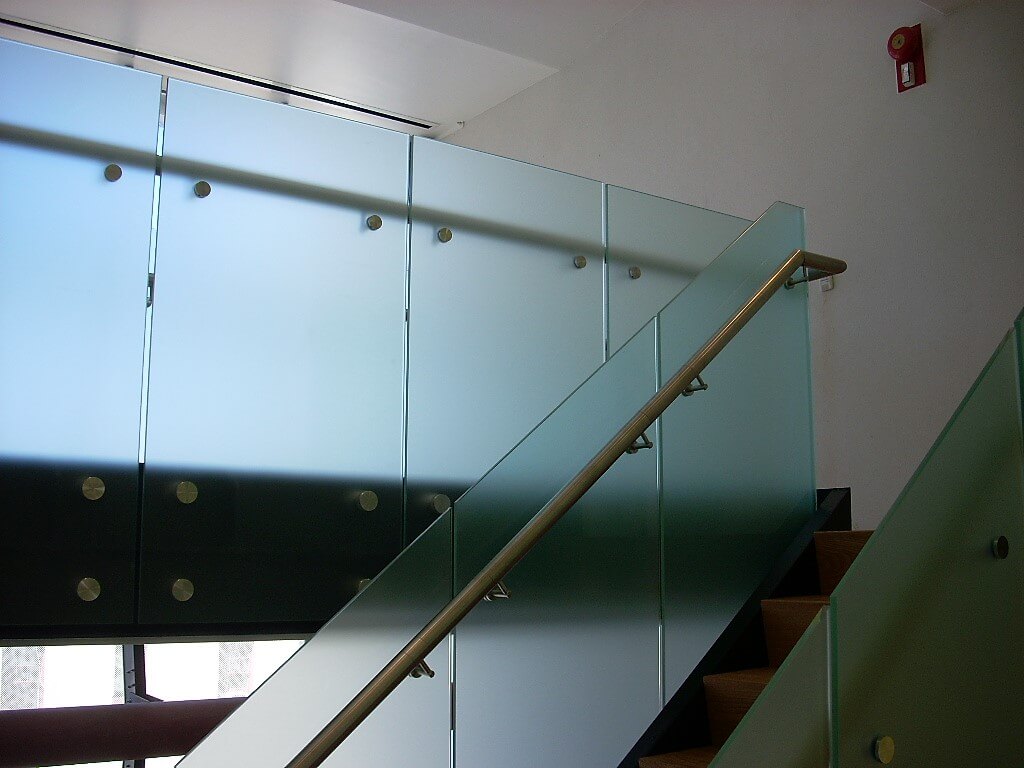 Upward stairwell view of Office building, CA, Optik guardrail with opaque etched glass