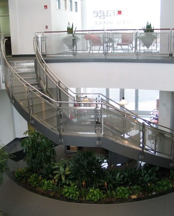 Inox curved stair rail with stainless steel infill installation at an EZ Storage, Baltimore, MD