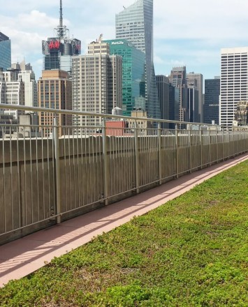 Outdoor balcony Circum round guardrail with picket infill installation at Empire State Building, NYC.
