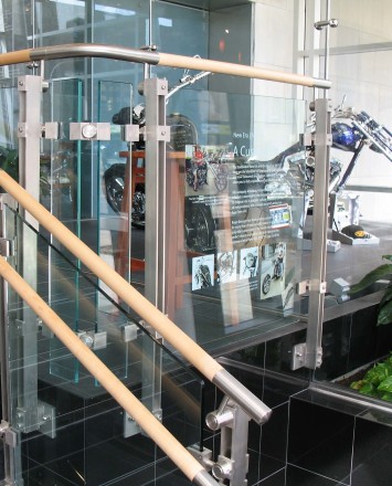 Closeup of Inox guardrail with custom glass infill panels at an office in Pennsylvania.