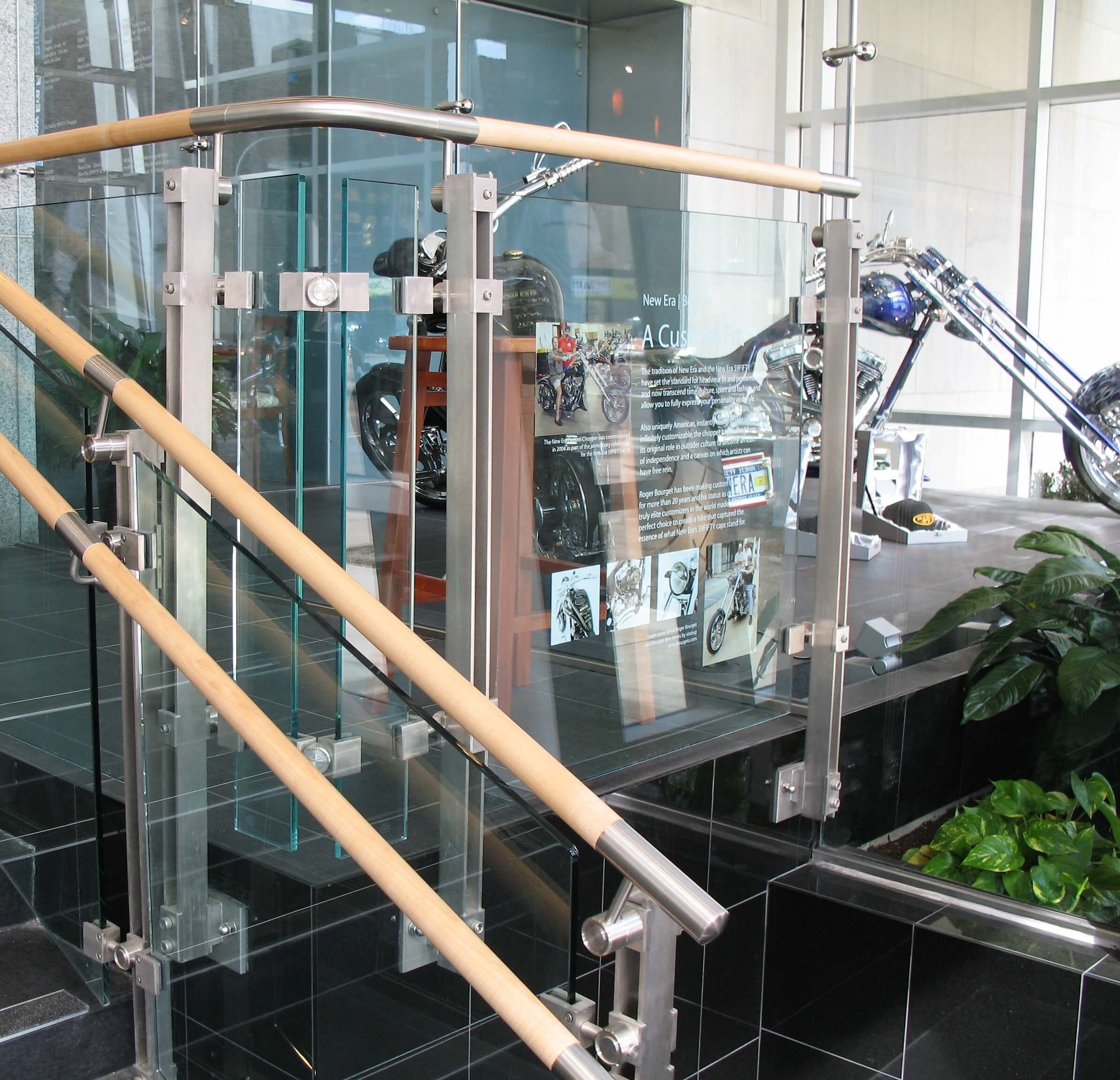 Closeup of Inox guardrail with custom glass infill panels at an office in Pennsylvania.