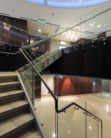 Upward lobby view of Barnes and Thornberg law offices, CA, Optik guardrail with clear glass
