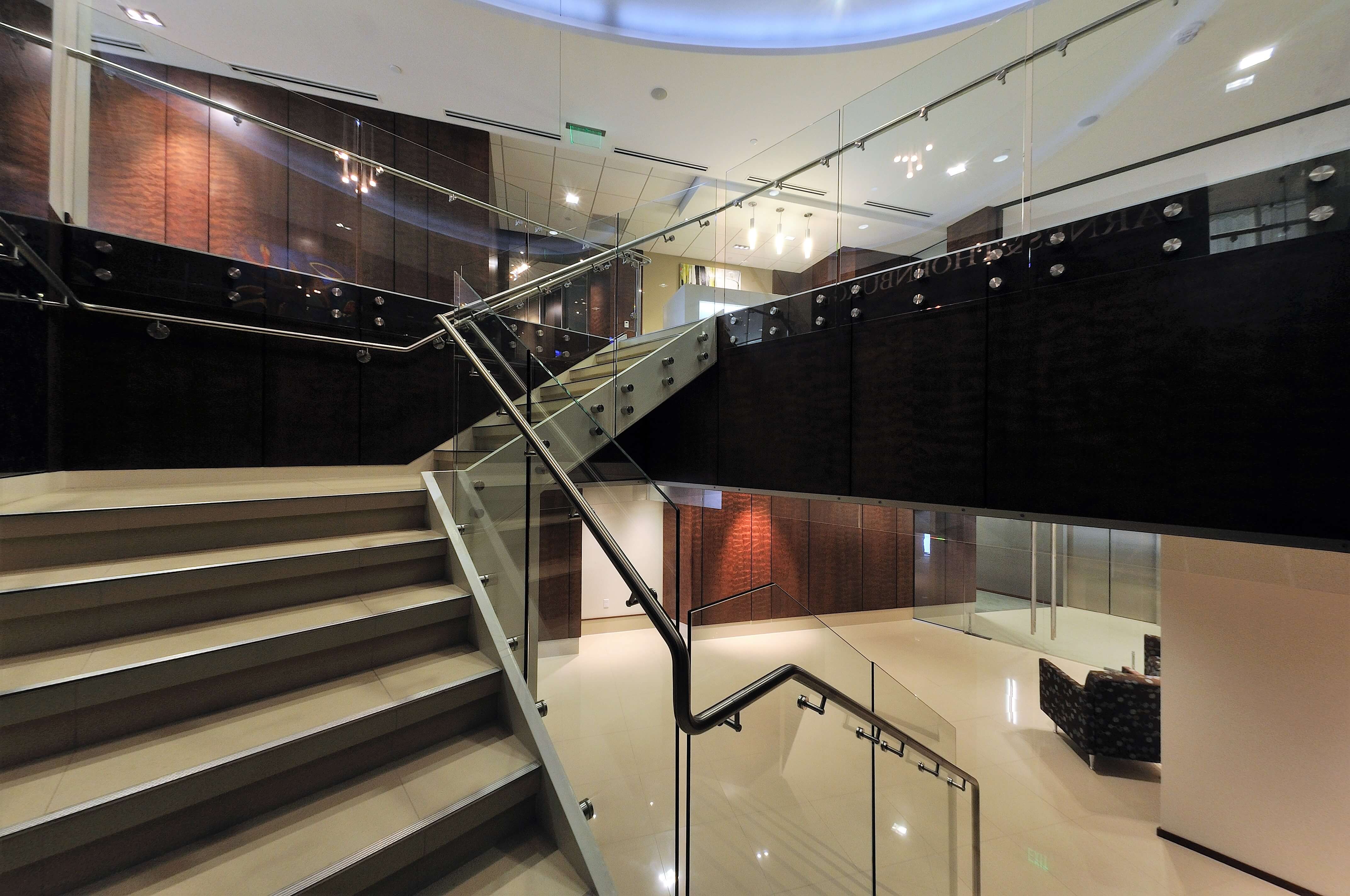Upward lobby view of Barnes and Thornberg law offices, CA, Optik guardrail with clear glass