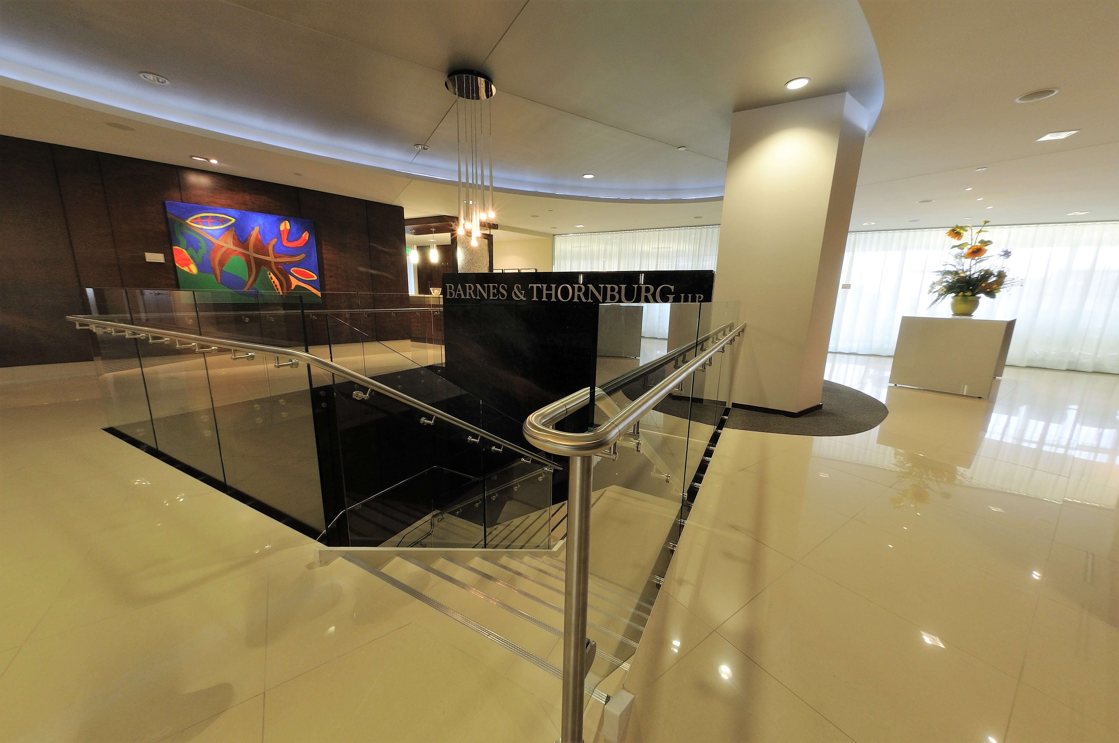 Upward lobby view of Barnes and Thornberg law offices, CA, Optik guardrail with clear glass