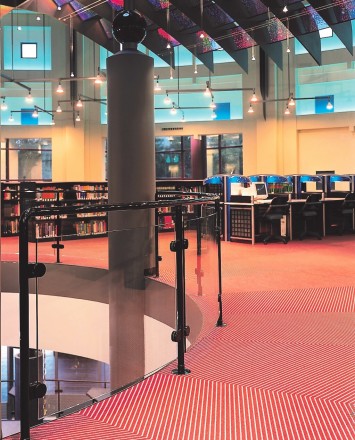 Curved Hewi guardrail with glass infill at the Kalamazoo Public Library, MI.