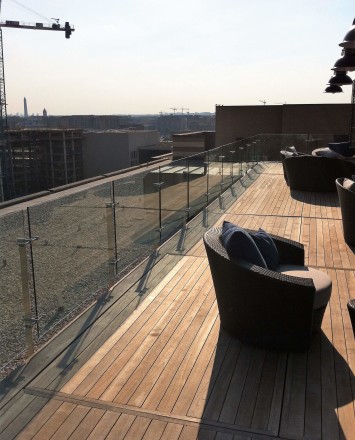 Outdoor balcony view of Rooftop Spa, DC, Kubit with glass infill panels.