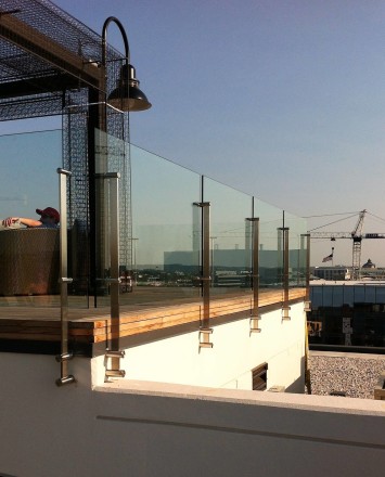 Outdoor balcony view of Rooftop Spa, DC, Kubit with glass infill panels.
