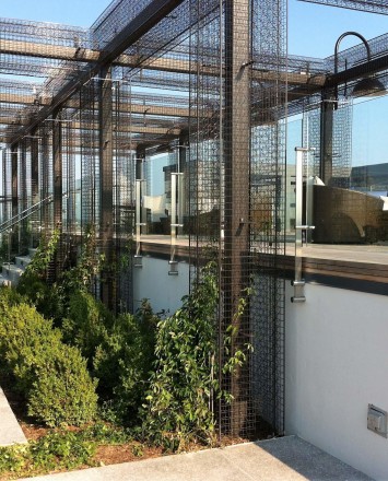 Outdoor balcony view of Rooftop Spa, DC, Kubit with glass infill panels.