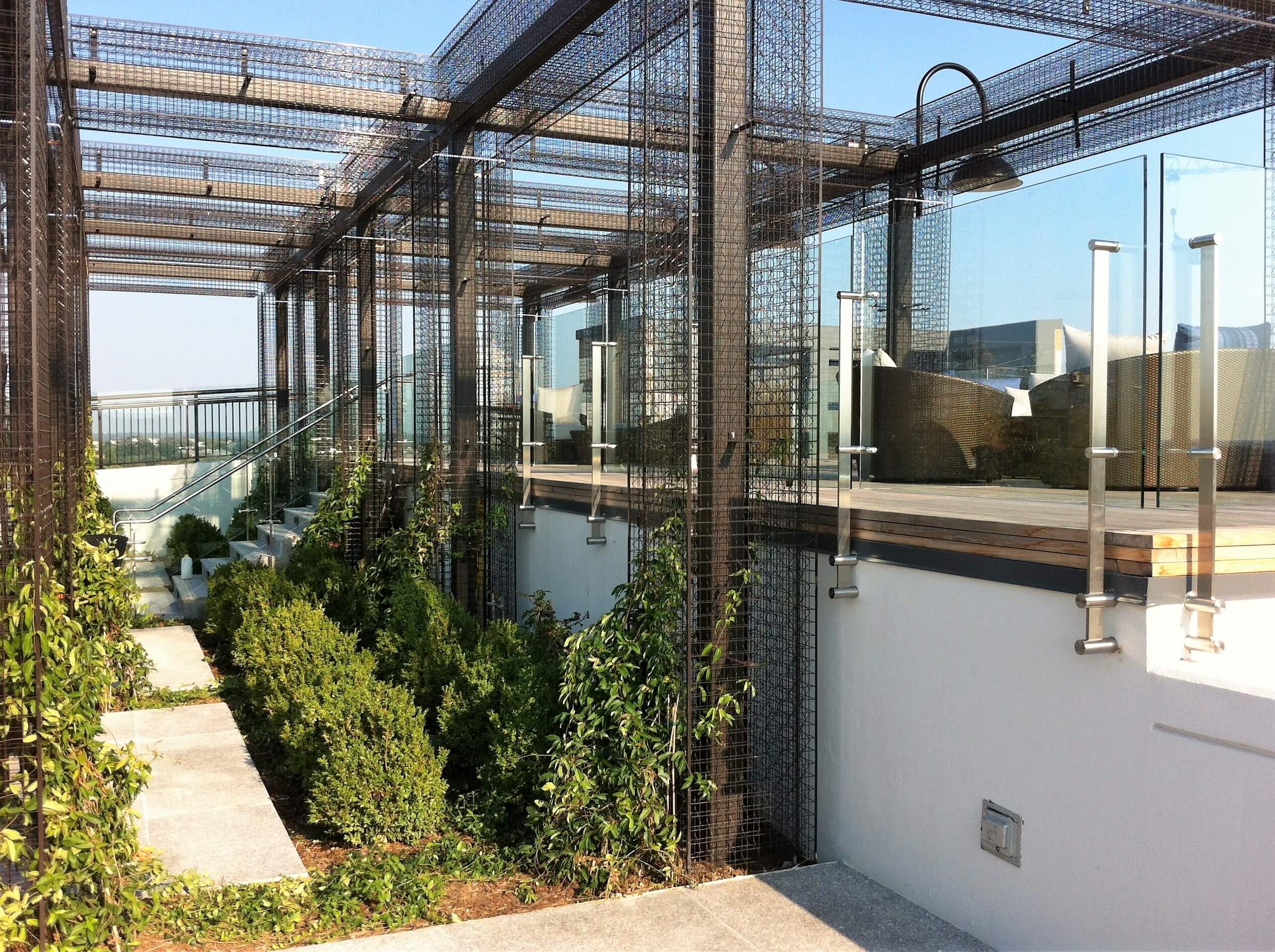 Outdoor balcony view of Rooftop Spa, DC, Kubit with glass infill panels.
