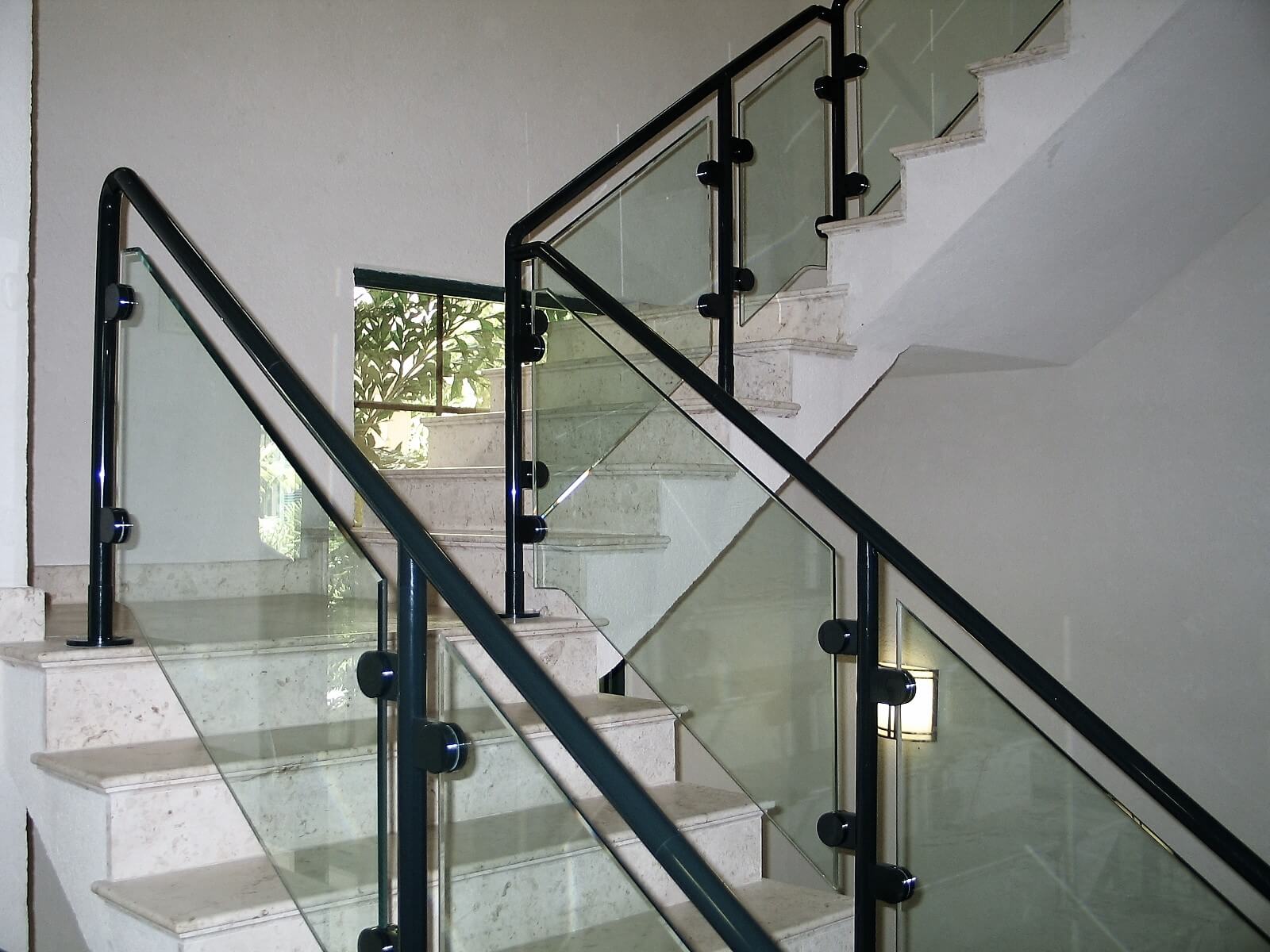 Stanford Bank, Antigua, HEWI guardrail surface mounted with clear glass infill panels