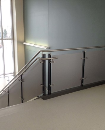 Closeup of Ferric guardrail with carbon fiber resin infill installation at Fox Valley Tech, WI.