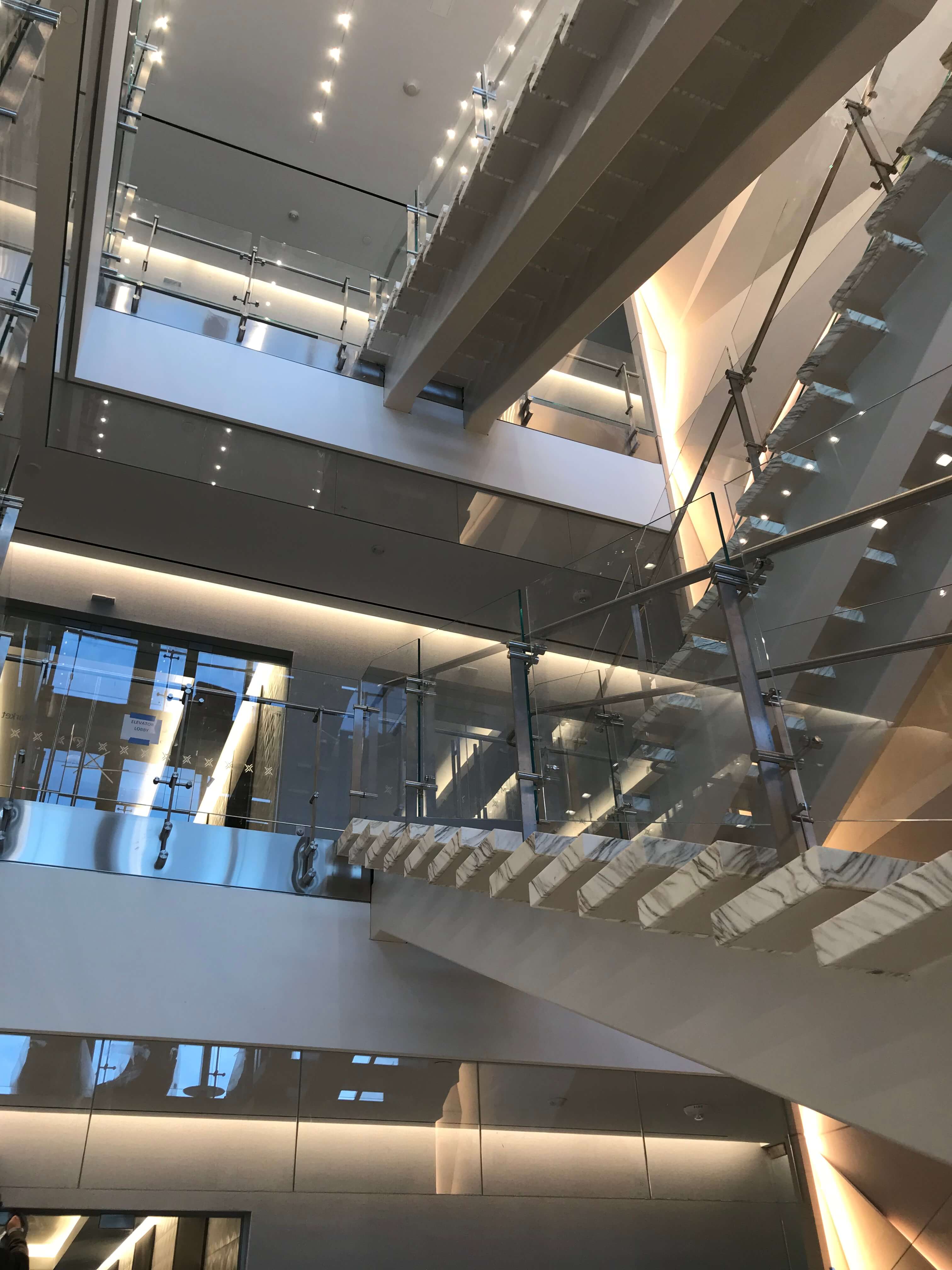 Atrium stair at Market Axess offices, Kubit glass railing system.