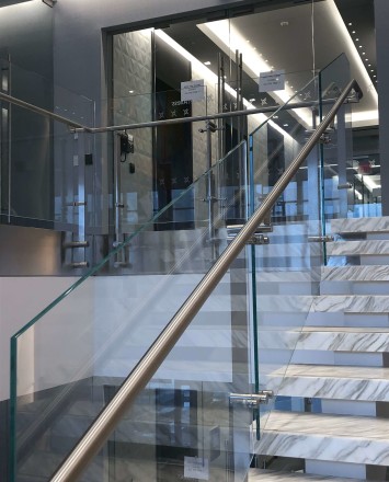 Atrium stair at Market Axess offices, Kubit glass railing system.