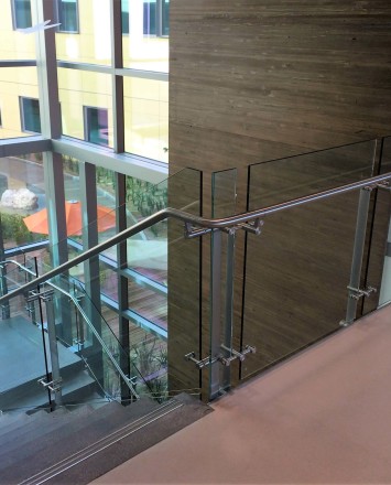 Konic guardrail installation with glass infill at Kaiser Permanente, CA.