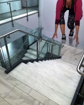 Stair at Full Beauty Brands offices, NY, Kubit glass railing system.