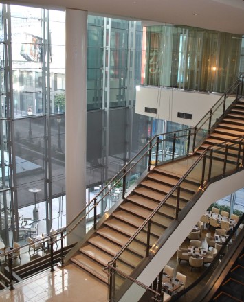 Ferric guardrail with glass infill installation at LA Live Convention Center, CA.