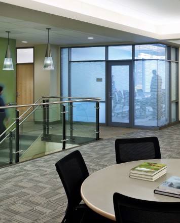 Ferric guardrail with glass infill installation at MIT Sloan School of Management, MA.