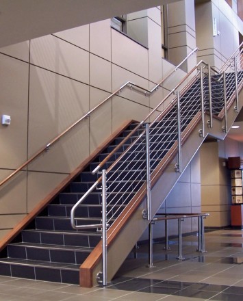 Circum round guardrail with infill rails and wood top rail at Midland National