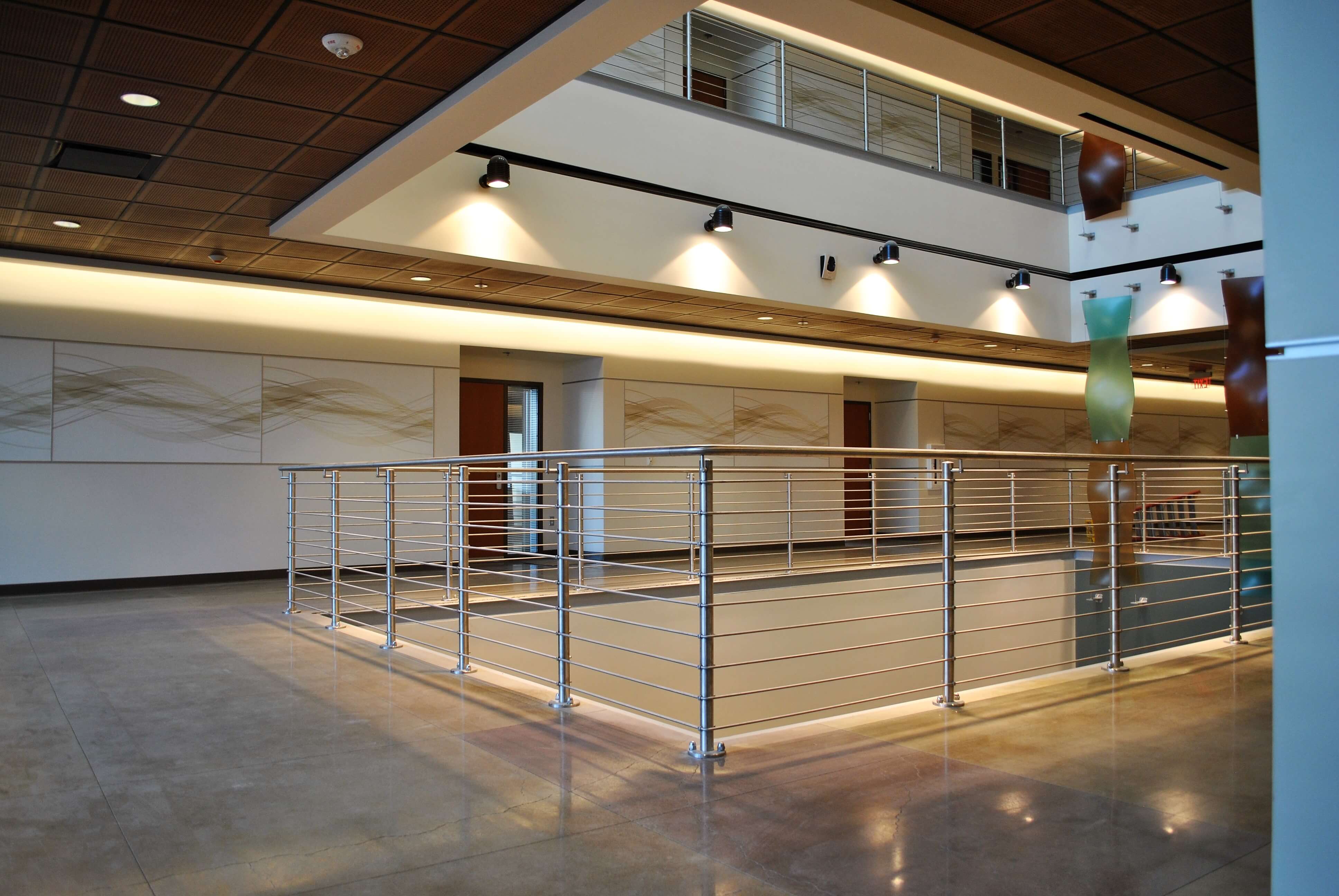 Circum round guardrail with stainless steel infill rails at Mission College, CA.