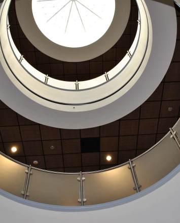 Circum round guardrail with resin infill panels at Mission College, CA.