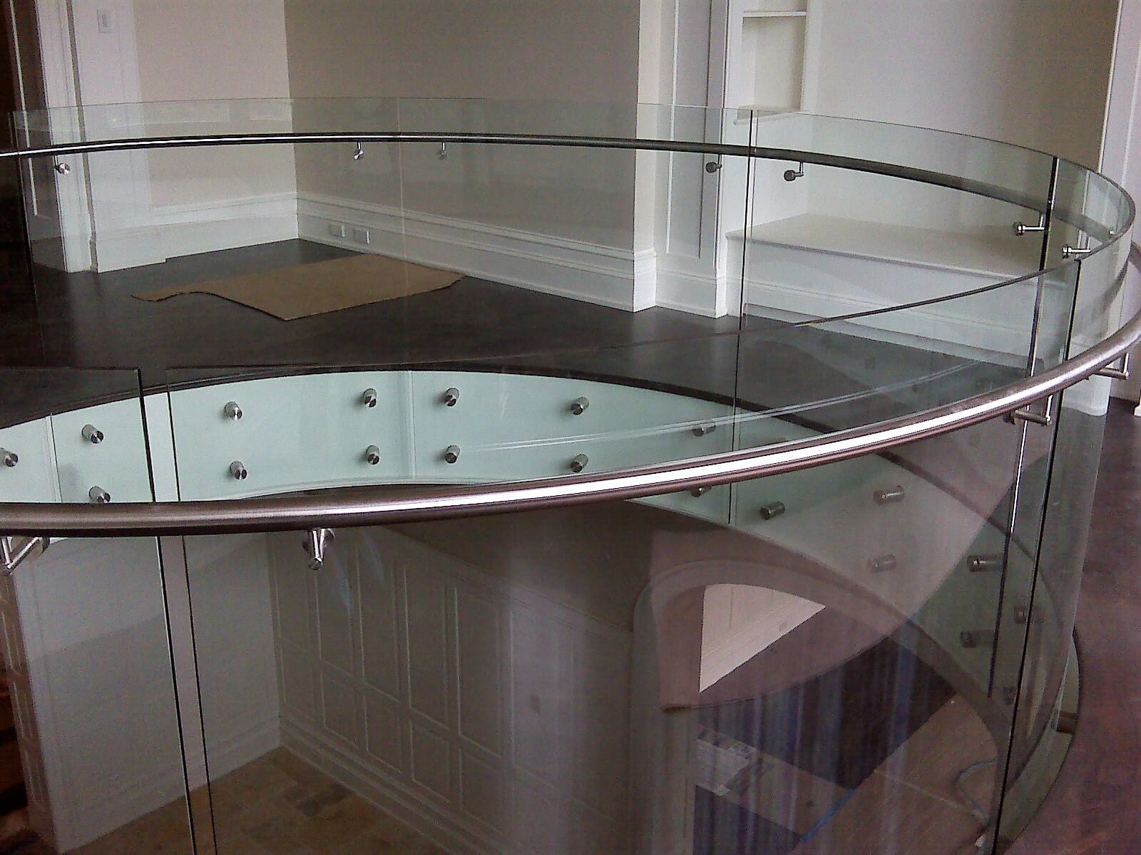 Second floor downward view in Private Residence, Washington DC, Optik guardrail with curved clear glass
