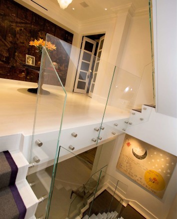 Entryway view of dual starwells in a Private Residence, Washington DC, Optik guardrail with clear glass