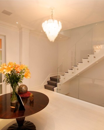 Entryway view of dual starwells in a Private Residence, Washington DC, Optik guardrail with clear glass