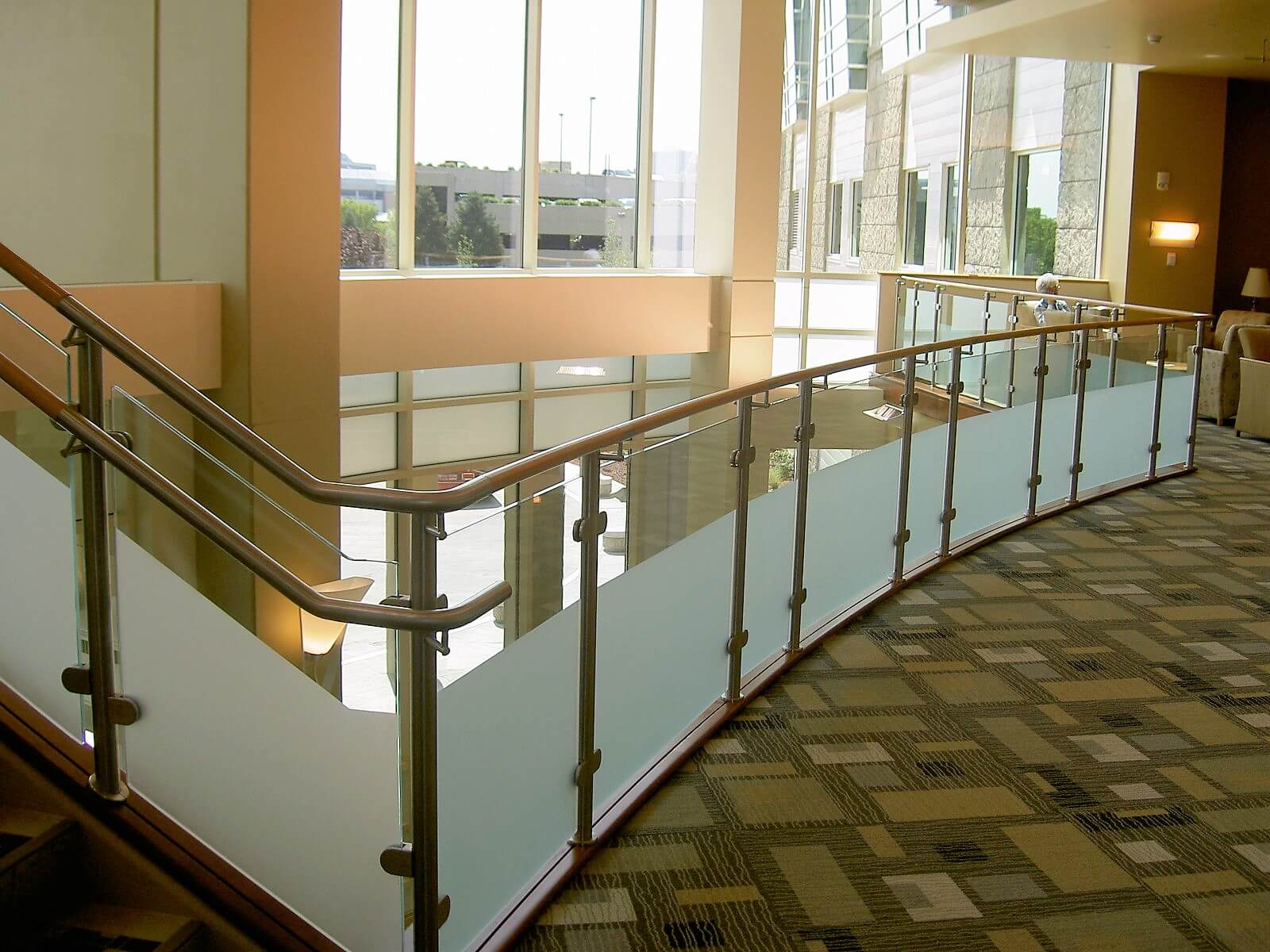 Circum guardrail installation with partially etched glass infill at Mercy Medical Center, OH.