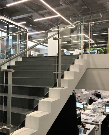 Stair at HOK Architects offices, DC, Kubit glass railing system.