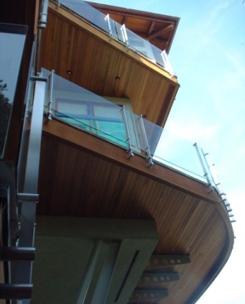 Ground level upward view of Kubit handrail system with glass infill at a Private California Residence