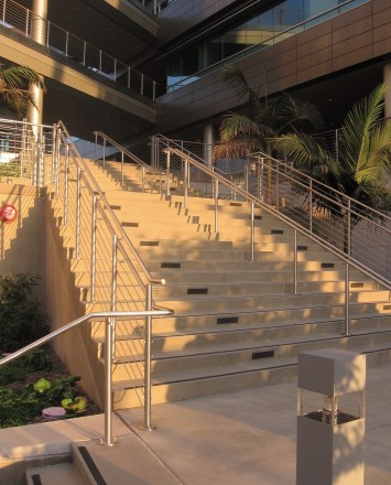 Circum wood handrail installation with horizontal infill rails at the Rady Schoolof Business, CA.