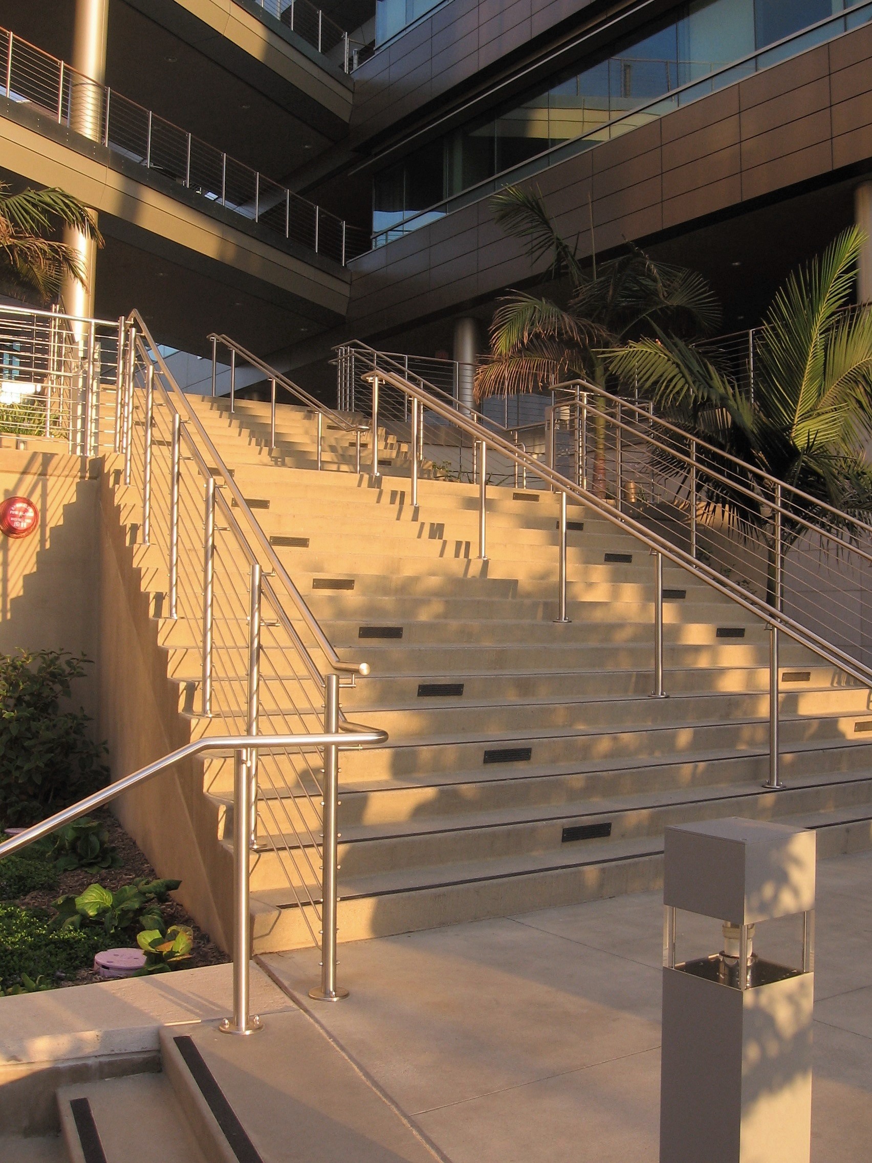 Circum wood handrail installation with horizontal infill rails at the Rady Schoolof Business, CA.