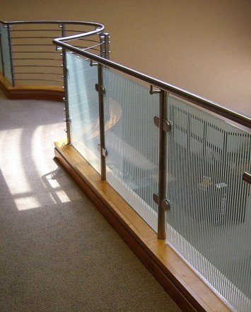 Circum guardrail with vertically etched glass infill installation at CTI Lobby