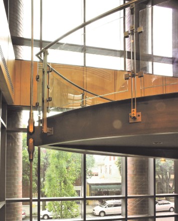 Inox curved handrail with glass infill installation at Princeton Public library, NJ.