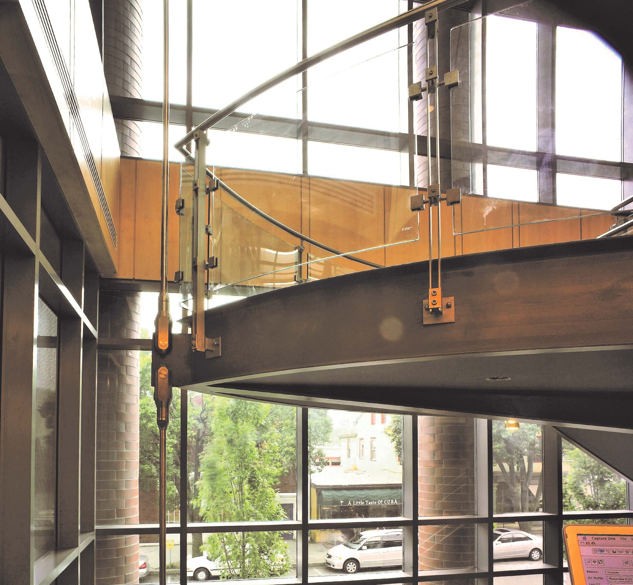 Inox curved handrail with glass infill installation at Princeton Public library, NJ.