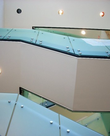 Upward stairwell view of Office building, CA, Optik guardrail with opaque etched glass