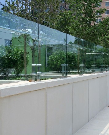 Outdoor balcony view of K Hovnanian HQ, NJ, Kubit short posts with glass infill panels and attached handrail