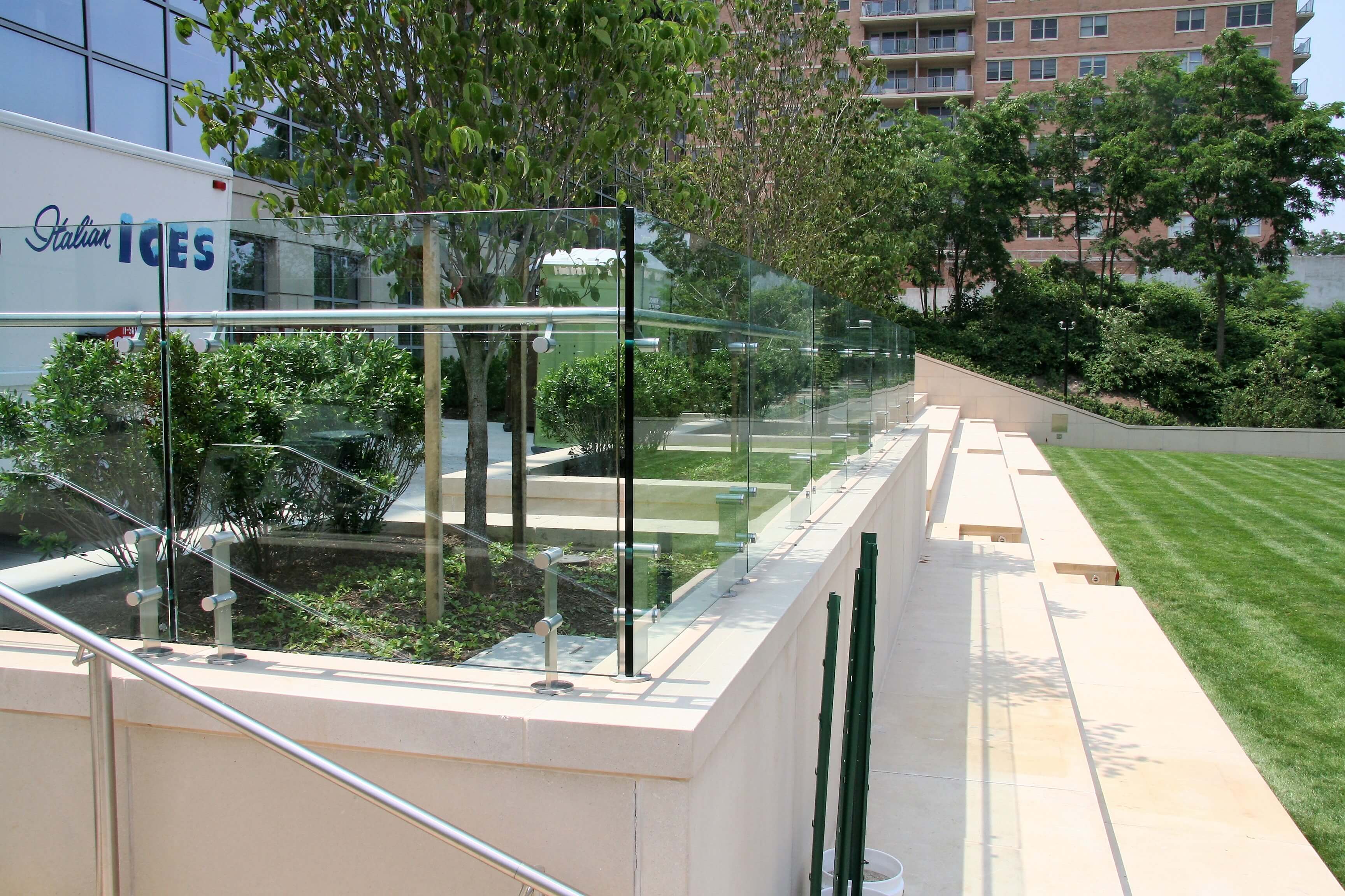 Outdoor balcony view of K Hovnanian HQ, NJ, Kubit short posts with glass infill panels and attached handrail