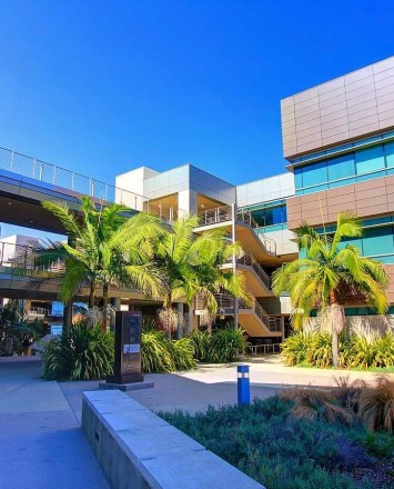 Circum wood handrail installation with horizontal infill rails at the Rady Schoolof Business, CA.