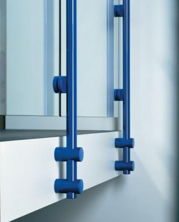 Closeup of Hewi guardrail installation with tinted glass infill at a private residence in Germany.