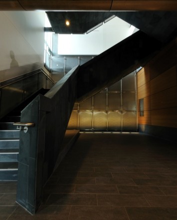 Upward view of Central Michigan University, MI, CIRCUM guardrail with perforated stainless steel infill panels