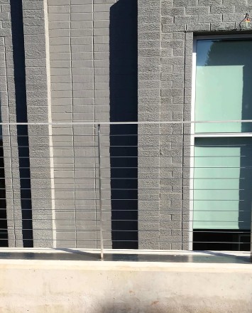View of Veeco Instruments, NJ, KOTO guardrail with posts welded to stainless steel plate.
